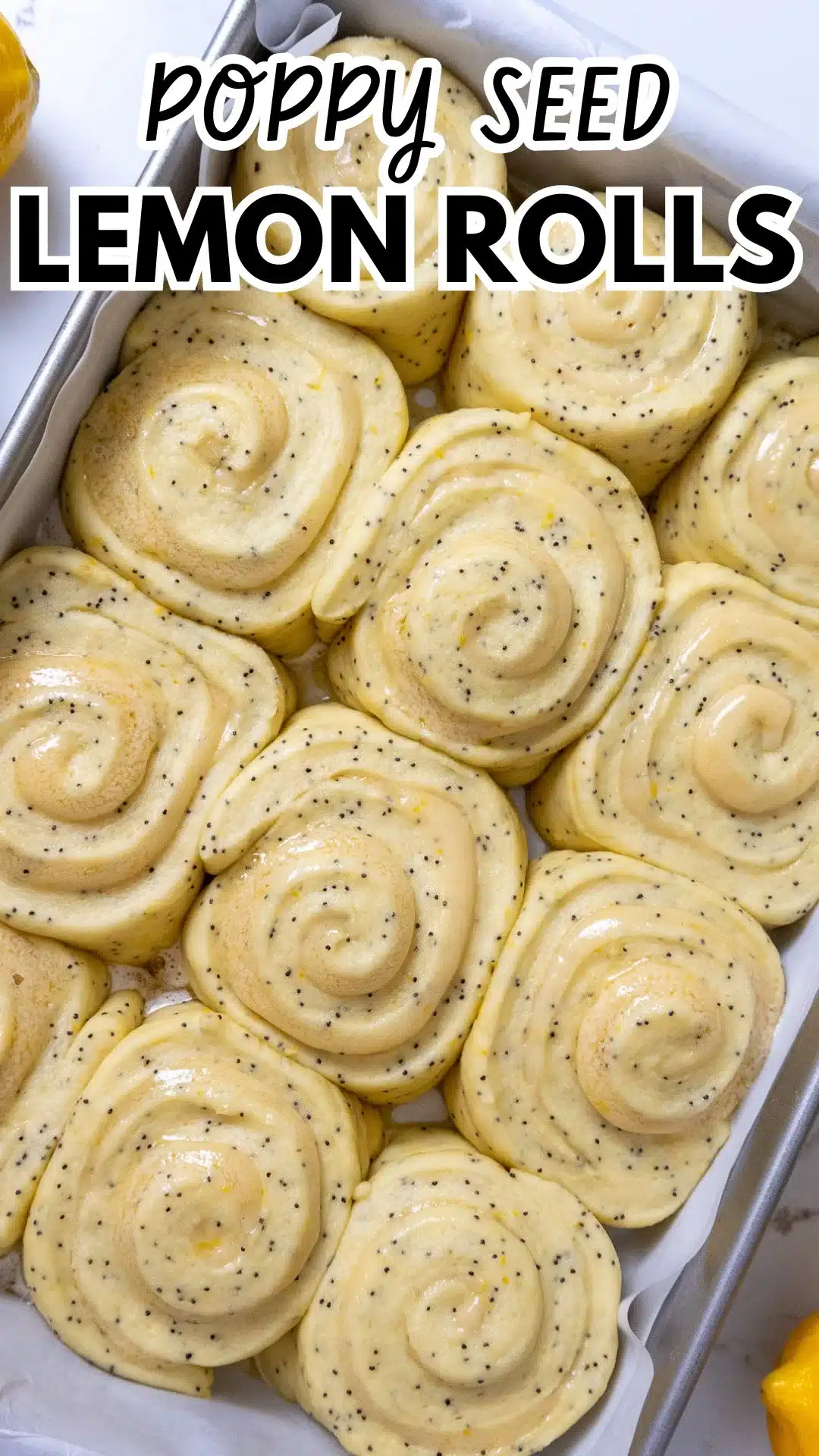 Freshly baked poppy seed lemon rolls with a citrus glaze.